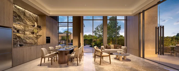 The Serra Residences residents’ dining room with lounge seating and garden views