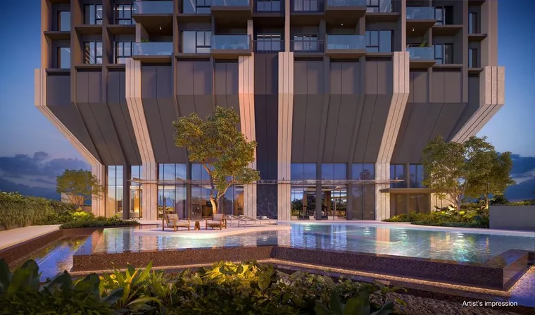 The Serra Residences spa pool and pool deck beneath the tower in the evening